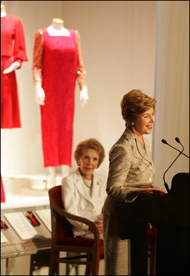 With former First Lady Nancy Reagan looking on, Laura Bush addresses the opening of The Heart Truth’s First Ladies Red Dress Collection Thursday, May 12, 2005, at the John F. Kennedy Center for the Performing Arts in Washington D.C. Mrs. Bush, the ambassador for The Heart Truth, wore her red Carolina Herrera suit to the Bolshoi Theater in Moscow and to The Heart Truth’s Red Dress Collection Fashion Show 2005 in New York City.