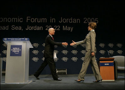 Klaus Schwab, chairman and founder of the World Economic Forum, welcomes Laura Bush to speak at the World Economic Forum at the Dead Sea in Jordan Saturday, May 21, 2005.