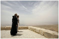 Laura Bush and Father Michele Piccirillo, head of the Franciscan Archeology Society, look out from the Judeo-Christian holy site of Mount Nebo in Jordan Saturday, May 21, 2005.