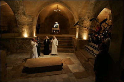 Brother Olivier, prior of the monastery, discusses the historical significance of the Church of the Resurrection at Abu Gosh, during Laura Bush's visit to the monastery in Israel, May 23, 2005.
