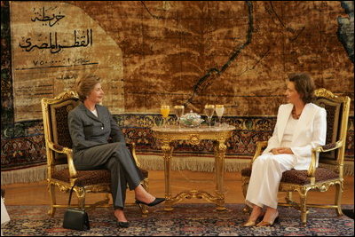 Laura Bush meets with Suzanne Mubarak, wife of Egyptian President Hosni Mubarek, at Ittihadiyya Palace in Cairo, Egypt, before spending the day together visiting an Egyptian girls school and taping a segment of children's television program "Alam Simsim" Monday, May 23, 2005.