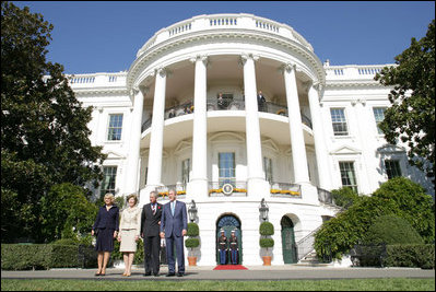 President George W. Bush and Laura Bush welcome the Prince of Wales and Duchess of Cornwall to the White House, Wednesday, Nov. 2, 2005.