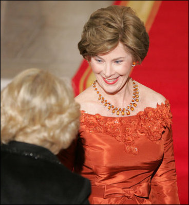 Laura Bush welcomes the Duchess of Cornwall upon the arrival of the Prince of Wales and the Duchess to the White House, Wednesday evening, Nov. 2, 2005.