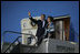 President George W. Bush and Laura Bush wave from Air Force One after landing Thursday, Nov. 3, 2005, in Mar del Plata, Argentina, where the President will participate in the Summit of the Americas.