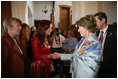 Mrs. Cristina Fernandez de Kirchner welcomes Mrs. Laura Bush to a luncheon Saturday, Nov. 5, 2005, in Mar del Plata, Argentina. The event, hosted by the Argentine First Lady, included a display on Eva Peron and a photo exhibit of important Argentine women depicting their culture.