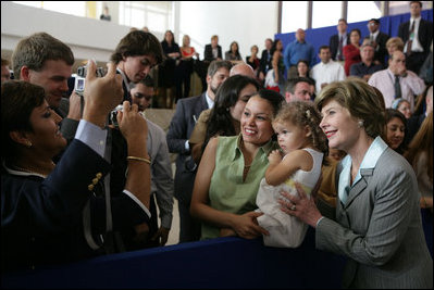 Laura Bush smiles as she greets staff and families at the U.S. Embassy in Brasilia, Brazil Saturday, Nov. 6, 2005.