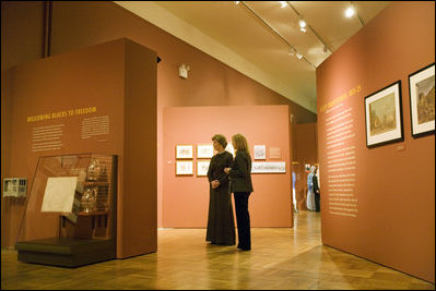 First Lady Laura Bush is lead by Dr. Louise Mirrer through a display of "Catherine Ferguson", part of the Slavery in New York exhibition currently running, after attending a New York History Makers Gala at the New York Historical Society in New York, NY, Tuesday, Nov. 8, 2005.