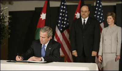 President George W. Bush and Mrs. Laura Bush, visit the Embassy of Jordan to sign a book of condolence, Thursday, Nov. 10, 2005 in Washington, in remembrance of those killed in the terrorist attacks, Wednesday, in Jordan.