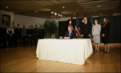 President George W. Bush signs a book of condolence, Thursday, Nov. 10, 2005 at the Embassy of Jordan in Washington, in remembrance of those killed in the terrorist attacks, Wednesday, in Jordan.