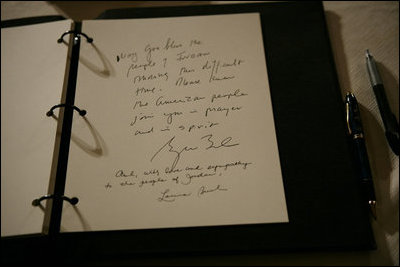 The sympathies of President George W. Bush and Mrs. Laura Bush, are seen written in a book of condolence for the people of Jordan, Thursday, Nov. 10, 2005 at the Embassy of Jordan in Washington.