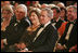 President George W. Bush and Mrs. Laura Bush listen to the evening's entertainment at the White House, Thursday, Nov. 10, 2005, following the dinner celebrating the 40th Anniversary of the National Endowment for the Arts and the National Endowment for the Humanities.
