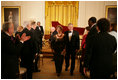 President George W. Bush and Mrs. Laura Bush are applauded at the conclusion of festivities at the White House, Thursday, Nov. 10, 2005, following the evening's celebration of the 40th Anniversary of the National Endowment for the Arts and the National Endowment for the Humanities.