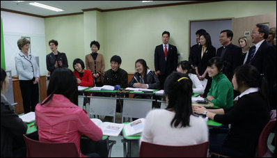 Mrs. Bush shares a moment with students at the Gyeongju English village in Gyeongju, Korea Thursday, Nov. 17, 2005.