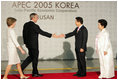 President and Mrs. Bush are welcomed by President Moo Hyun Roh of the Republic of Korea, and his wife, Yang-Sook Kwon, to the Gala Dinner and Cultural Performance at the 2005 APEC summit Friday night, Nov. 18, 2005.