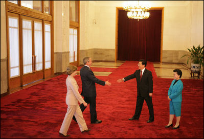 President and Mrs. Bush are greeted Sunday, Nov. 20, 2005, by China's President Hu Jintao and wife, Madame Liu, at the Great Hall of the People in Beijing.