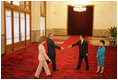 President and Mrs. Bush are greeted Sunday, Nov. 20, 2005, by China's President Hu Jintao and wife, Madame Liu, at the Great Hall of the People in Beijing.