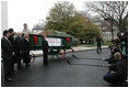 Laura Bush welcomes the arrival of the official White House Christmas tree delivered, Monday, Nov. 28, 2005, on a horse drawn wagon. This year's tree, donated by the Deal Family of Smokey Holler Tree Farm in Laurel Springs, N.C., is the 40th year the National Christmas Tree Growers Association has provided a tree to the White House.