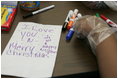 A personal note is written on a sandwich bag by a student Wednesday, Nov. 30, 2005 during a visit to the Church of the Epiphany in Washington by Mrs. Laura Bush, as part of her Helping America's Youth initiative. The students, part of the Youth Service Learning Project, were preparing sandwiches for the homeless.