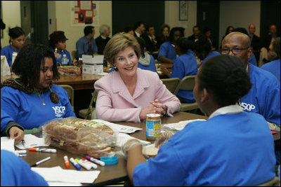 Laura Bush talks with students Wednesday, Nov. 30, 2005 during a visit to the Church of the Epiphany in Washington, as part of her Helping America's Youth initiative, where the students, part of the Youth Service Learning Project, were preparing sandwiches to feed the homeless.