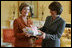 Laura Bush presents Mrs. Zorka Parvanova, First Lady of the Republic of Bulgaria, Monday, October 17, 2005, with signed children's books for the shelves of Sofia City Public Library in Sofia City, Bulgaria.