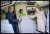 President George W. Bush, Mrs. Bush and Nancy Reagan tour the plane that served as Air Force One for President Reagan and six other Presidents from 1973 to 2001 at the Ronald Reagan Presidential Library in Simi Valley, California, Friday, Oct. 21, 2005.