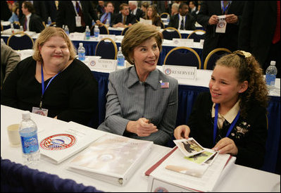 Laura Bush sits with Michaela Huberty, right, and her mentor, Jennifer Kalenborn, left, Thursday, Oct. 27, 2005 at Howard University in Washington, at the White House Conference on Helping America's Youth.