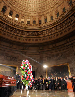 President George W. Bush and Laura Bush honor Rosa Parks during a wreath-laying ceremony in the Rotunda of the U.S. Capitol in Washington, D.C., Sunday Oct. 30, 2005. The casket of Rosa Parks will rest in the U.S. Capitol until Monday evening.