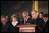 President George W. Bush and Laura Bush participate in a prayer led by Reverend Daniel Coughlin, House Chaplain, in honor of Rosa Parks during a wreath-laying ceremony in the Rotunda of the U.S. Capitol in Washington, D.C., Sunday Oct. 30, 2005. Rosa Parks passed away Monday, Oct. 24th.