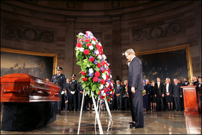 President George W. Bush and Laura Bush present the Executive Branch Wreath during a wreath-laying ceremony in honor of Rosa Parks, in the Rotunda of the U.S. Capitol in Washington, D.C., Sunday Oct. 30, 2005.