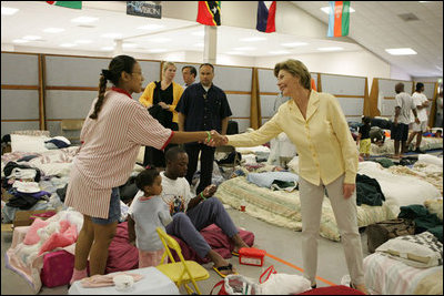 Laura Bush visits people affected by Hurricane Katrina at the Bethany World Prayer Center shelter, Monday, Sept. 5, 2005 in Baton Rouge, Louisiana, where hundreds of people have taken refuge.