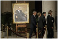President George W. Bush and Laura Bush walk with Justice Antonin Scalia and Sally Rider, the Chief Justice's assistant, after viewing a portrait of Chief Justice William Rehnquist as his body lies in repose in the Great Hall of the U.S. Supreme Court Tuesday, Sept. 6, 2005.