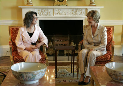 Laura Bush visits with Mrs. Hero Ibrahim Ahmed, wife of Iraqi President Jalal Talabani, during a tea in the private residence of the White House Monday, Sept. 12, 2005.