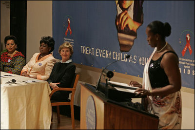 Laura Bush listens to Jeannette Kagame, the First Lady of Rwanda and President of the Organization of African First Ladies Against HIV/AIDS, addresses the group in New York Thursday, Sept. 15, 2005.