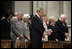 President George W. Bush bows his head in prayer during the National Day of Prayer and Remembrance Service at the Washington National Cathedral in Washington, D.C., Friday, Sept. 16, 2005. Also pictured are Laura Bush, Lynne Cheney Vice President Cheney, Secretary Rice and Secretary Rumsfeld.