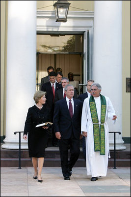 President Bush and First Lady Laura Bush walk with Rev. Luis Leon after attending a Service of Prayer and Remembrance for 9/11 victims at St. John's Episcopal Church in Washington, DC, September 11, 2005. This marks the fourth anniversary of terrorist attacks on both the World Trade Center and The Pentagon.