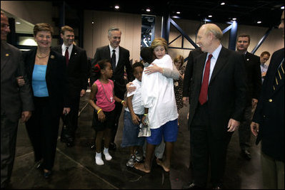 Laura Bush is greeted by three youngsters upon her arrival Monday, Sept. 19, 2005, to "Operation Compassion" at George R. Brown Convention Center in Houston.