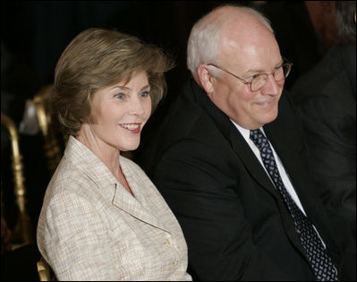 Laura Bush and Vice President Dick Cheney sit together, Thursday, Sept. 29, 2005, during the swearing-in ceremony for John G. Roberts, Jr., Chief Justice of the United States Supreme Court, in the East Room of the White House.