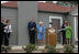 Former President George H.W. Bush and Mrs. Barbara Bush share a laugh with Mrs. Laura Bush and Midland friends, George Scott, Jan O'Neill, and Joe O'Neill, after cutting the ribbon on Tuesday, April 11, 2006, at the dedication of the President George W. Bush's Childhood Home in Midland, Texas.