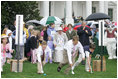 Mrs. Laura Bush and President George W. Bush welcome guests to the 2006 White House Easter Egg Roll, Monday, April 17, 2006, a tradition on the South Lawn of the White House since 1878.