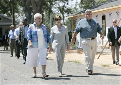 Mrs. Laura Bush meets with Biloxi, Miss., residents Sandy Patterson, left, and her husband, Thomas "Lynn" Patterson Monday, Aug. 28, 2006, during a walking tour in the same Biloxi neighborhood President George W. Bush visited following Hurricane Katrina in September 2005. The tour allowed President Bush the opportunity to assess the progress of the area's recovery and rebuilding efforts a year after the devastating hurricane.