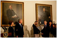 President George W. Bush and Laura Bush watch as Ariel Cohen, 14, lights the Menorah on the fourth night of Hanukkah during the annual White House Hanukkah reception Monday, Dec. 18, 2006. Pictured at right are Ariel's parents, Dan and Rachel Cohen, and sister Alison, 11.