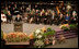 President George W. Bush addresses guests at the homegoing celebration for Coretta Scott King, Tuesday, Feb. 7, 2006 at the New Birth Missionary Church in Atlanta, Ga. In the background-right are Mrs. Laura Bush, former President Bill Clinton, U.S. Sen. Hillary Clinton, former President George H. W. Bush, former President Jimmy Carter, Mrs. Roslyn Carter and U.S. Sen. Edward M. Kennedy.