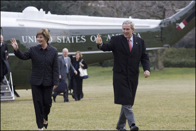 President George W. Bush and Laura Bush arrive on the South lawn at the White House returning from delivering remarks on the 2006 agenda in Nashville, Tennessee, Wednesday, Feb. 1, 2006.