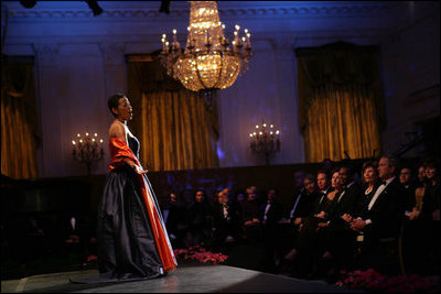 President George W. Bush and Laura Bush listen to soprano Harolyn Blackwell perform in the East Room of the White House during a dinner in honor of The Dance Theatre of Harlem Monday, February 6, 2006.