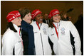 Laura Bush poses for photos with 2006 U.S. Winter Olympic athletes in Turin, Italy, Friday, Feb. 10, 2006 before the Opening Ceremony.