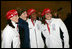 Laura Bush poses for photos with 2006 U.S. Winter Olympic athletes in Turin, Italy, Friday, Feb. 10, 2006 before the Opening Ceremony.