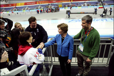 Laura Bush and former Olympian Dr. Eric Heiden meets with the family and parents of US speed skater Chad Hedrick after Hedrick finished first place in his heat taking the first US gold medal in the 2006 Winter Olympics in Turin, Italy.