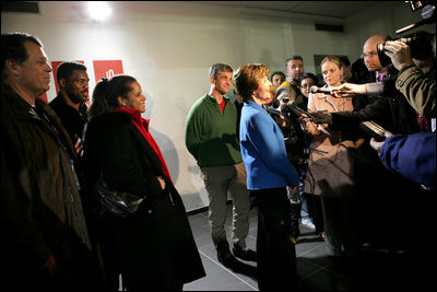 Laura Bush flanked by members of the U.S. Olympic Delegation, (from left) Roland Betts, Dr. Debi Thomas, Herschel Walker and Dr. Eric Heiden meet with members of the press after watching the Men’s U.S. Speed Skating competition at the 2006 Winter Olympics in Turin, Italy.