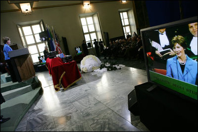 Laura Bush delivers remarks at the University of Turin Saturday, Feb. 11, 2006, in Turin, Italy, Saturday, Feb. 11, 2006. Mrs. Bush announced a donation, made possible by the U.S. Department of State, of more than 200 American books to the University of Turin American studies program.