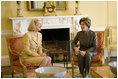 Laura Bush shares a moment with Nane Annan, wife of UN Secretary General Kofi Annan, Monday, Feb. 13, 2006, during a morning meeting in the private residence at the White House.